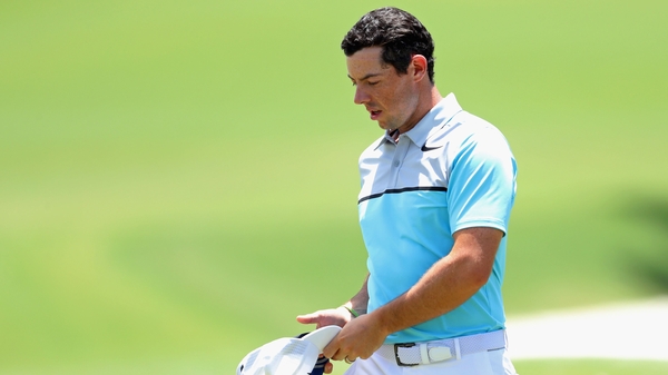 McIlroy walks off the ninth green at TPC Sawgrass during his second round on Friday