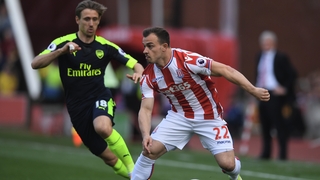 Xherdan Shaqiri attempts to get away from Nacho Monreal