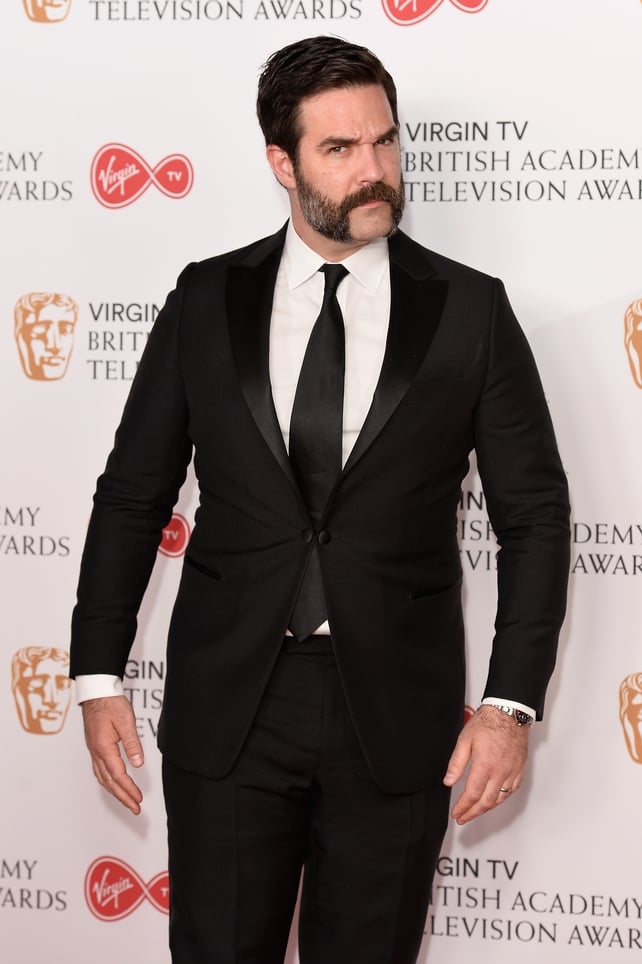 Catastrophe's Rob Delaney wore a simple black suit and impressive handlebar mustache.