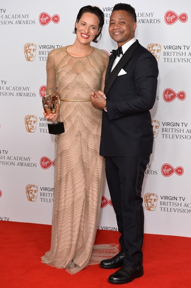 Phoebe Waller-Bridge and Cuba Gooding Jr. pose with Phoebe's award for Female Performance in a Comedy Programme. She wore a gorgeous golden Jenny Packham gown.