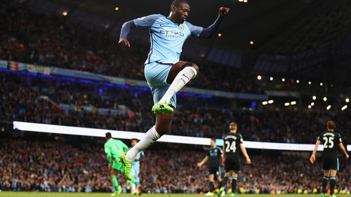 Yaya Toure celebrates his side's third goal