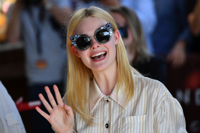 Day One - Wednesday May 17: Actress Elle Fanning arrived this morning wearing a fabulous pair of sunglasses. We need them for festival season.