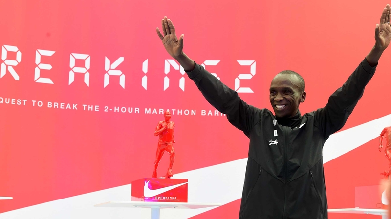Eluid Kipchoge celebrates after his Breaking2 marathon attempt