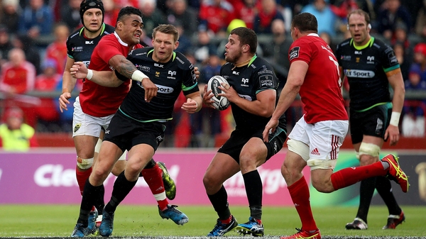 Munster's Francis Saili tackles Ospreys' Dan Biggar