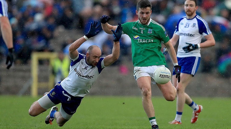 Monaghan's Gavin Doogan attempts to block Ryan Lyons of Fermanagh