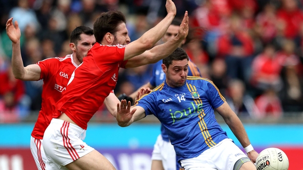 Louth's Kevin Carr blocks a Sean Furlong kick