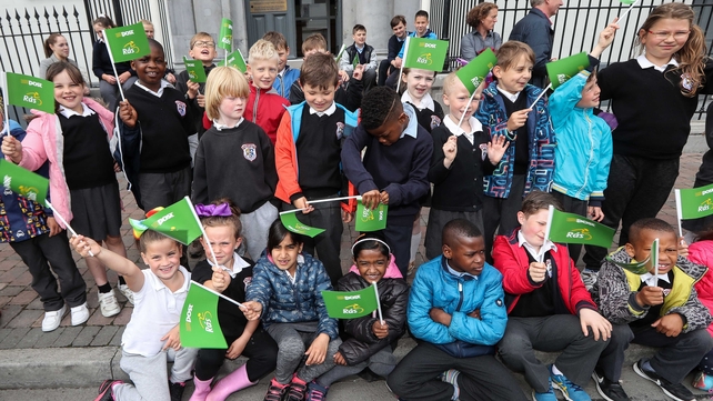 Students from St Emer's National School cheer at the start line