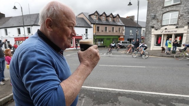 Peter Gill from Claremorris watches the Rás pass through the town