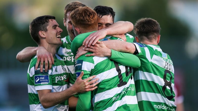 Gary Shaw celebrates with teammates after scoring the opening goal