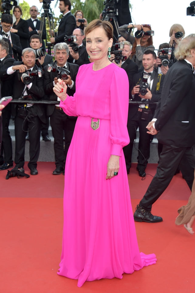 Day Six - Monday May 22:
The timeless beauty of Kristin Scott Thomas is glorified by this fuchsia Schiaparelli gown. We love the glittery padlock detail of the dress.