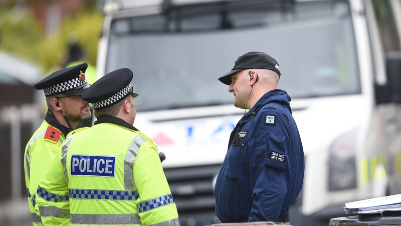 Police outside a property in Greater Manchester