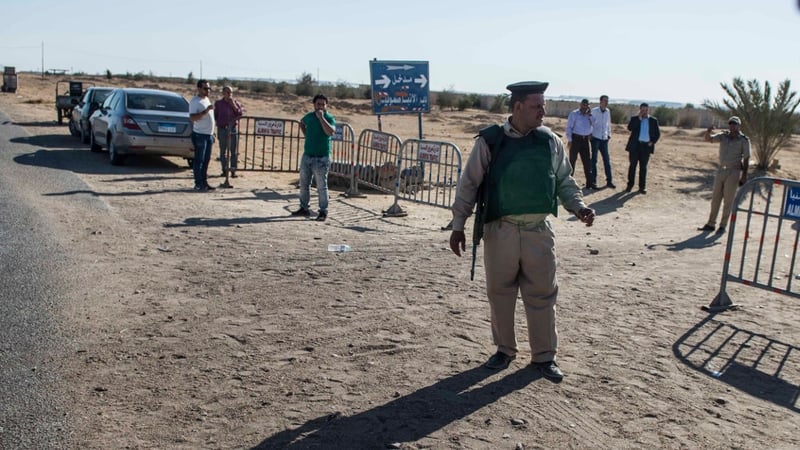 A soldier stands at the entrance to the Monastery of St Samuel the Confessor near where the attack took place