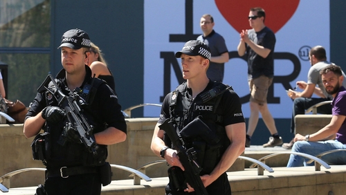 Armed police maintain a visible presence on Manchester's streets