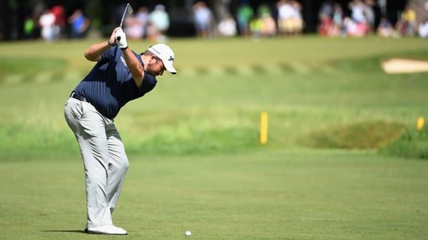 Lowry plays his approach to the 15th at Wentworth on Saturday
