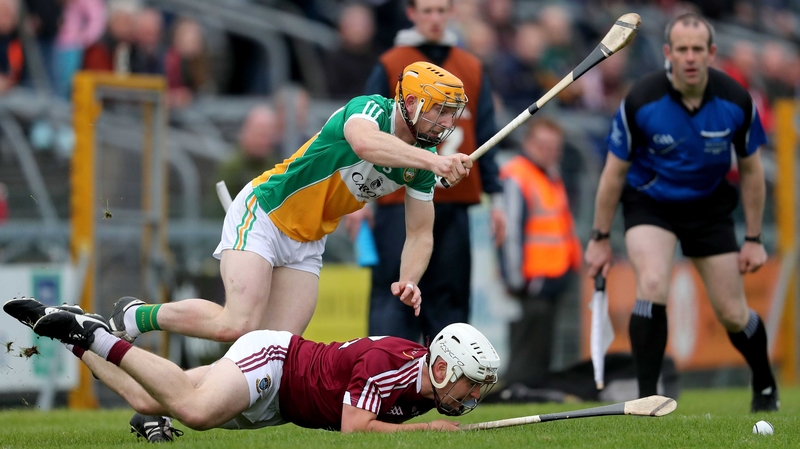 Westmeath's Killian Doyle feel the full force of Offaly's Sean Gardiner