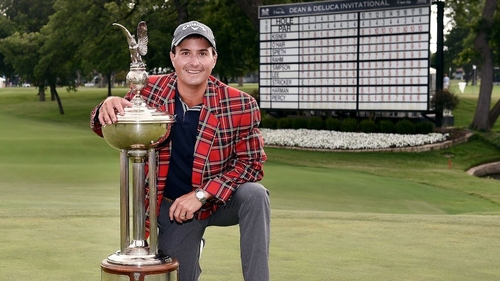 Kevin Kisner celebrates with the Leonard Trophy after winning the DEAN & DELUCA Invitational