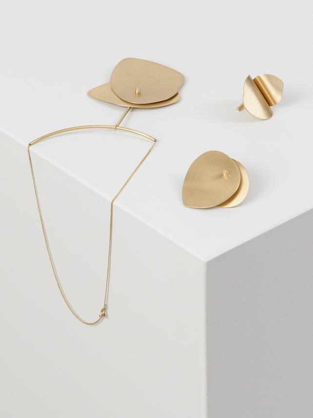 Refined gold jewelry that goes with everything for COS.