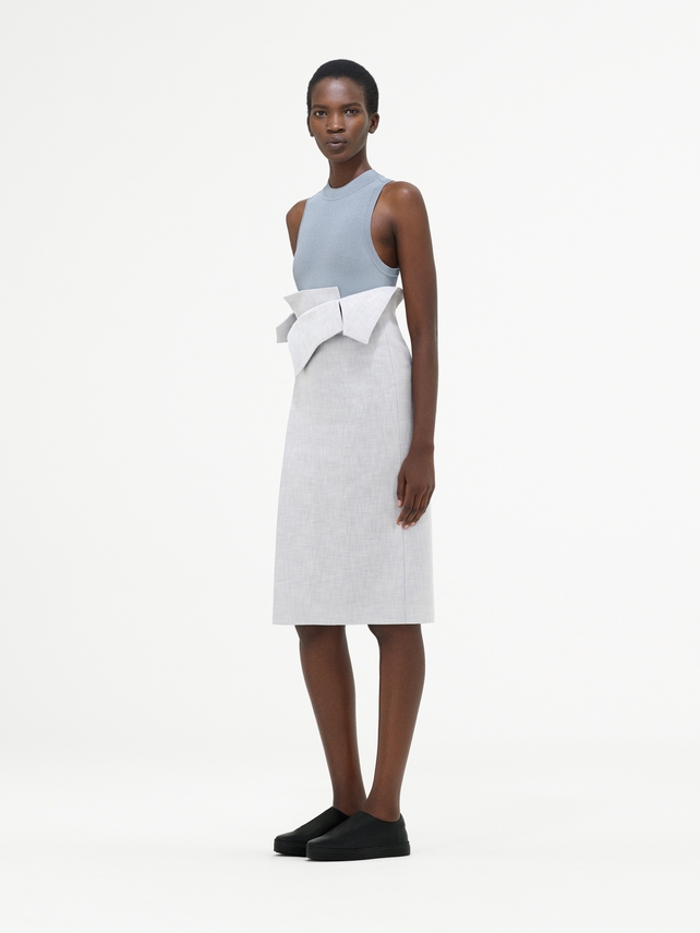 Pale blue top and high-waisted relief skirt from COS. Minimal is the new chic.