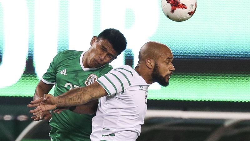 Ireland's David McGoldrick challenges Mexico's Jesus Gallardo
