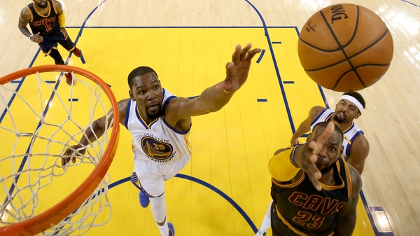 Golden State's Kevin Durant attempts to defend LeBron James during Game 1