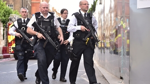 Armed police patrol the area the morning after the attack