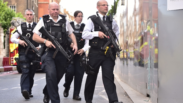 Armed police patrol the area the morning after the attack