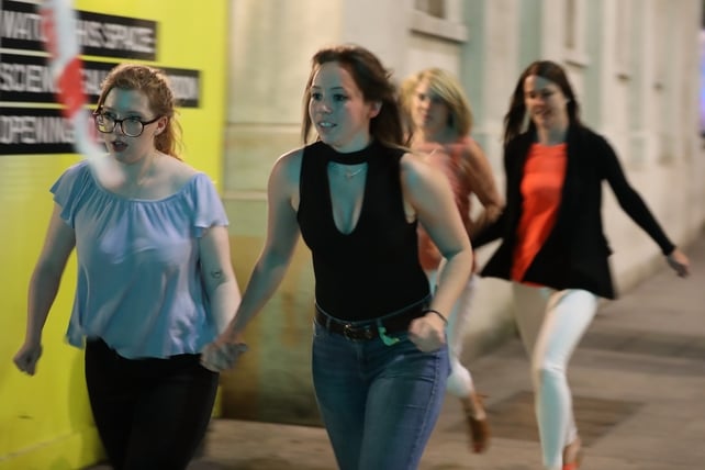 People run as reports of gunfire heard