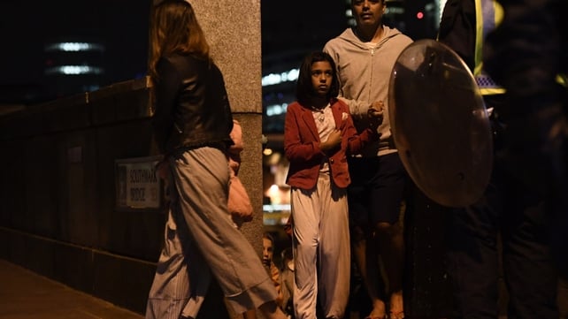 A young girl is among those being led away from Southwark Bridge