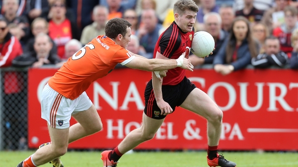 Conor Maginn gets away from Brendan Donaghy