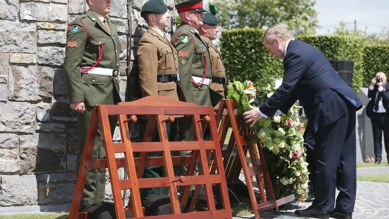 Taoiseach Enda Kenny laid a wreath at the foot of the Round Tower memorial