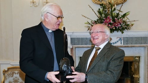 Humanitarian priest Jack Finucane, pictured with President Michael D Higgins in 2014