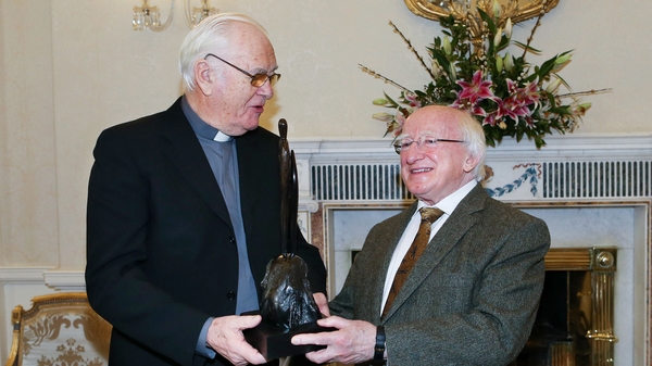 Humanitarian priest Jack Finucane, pictured with President Michael D Higgins in 2014
