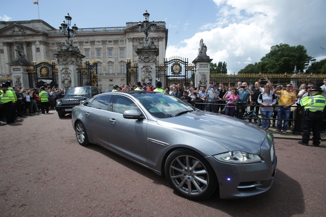 The car carrying Theresa May leaves Buckingham Palace after her audience with Queen Elizabeth