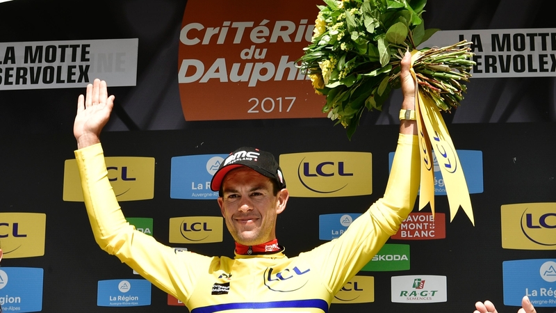 Richie Porte celebrates claiming the yellow jersey