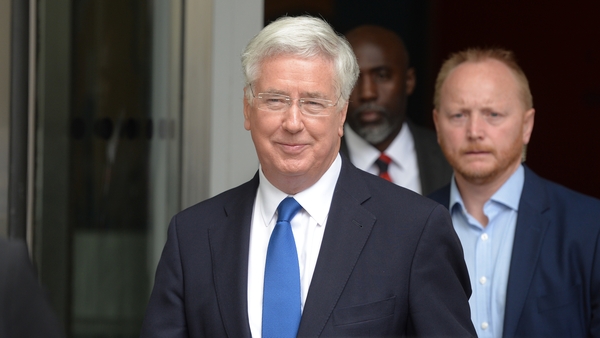 The British Defence Secretary apologised for touching a journalist's knee
