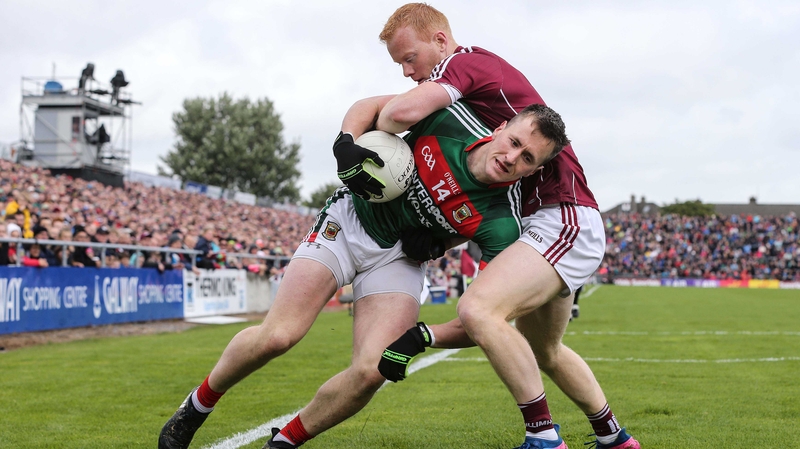 Declan Kyne of Galway and Mayo's Cillian O'Connor tussle
