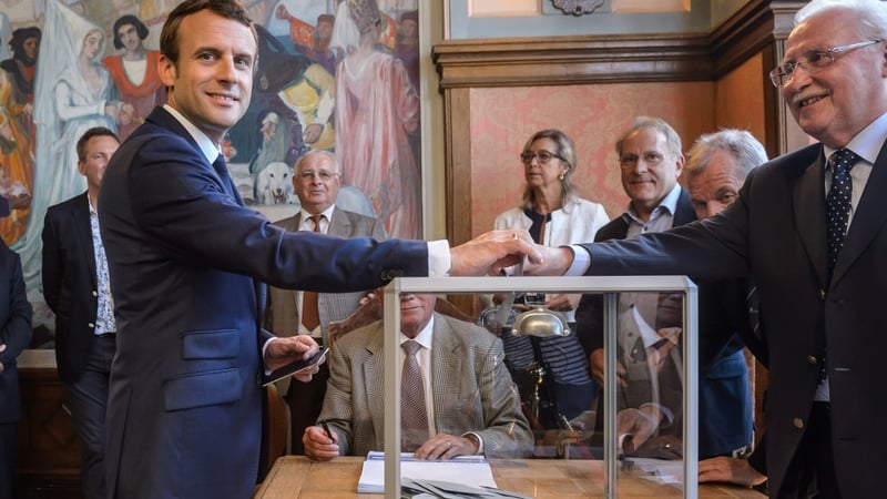 Emmanuel Macron casts his vote
