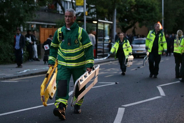 Members of the emergency services at the scene of the massive blaze in west London