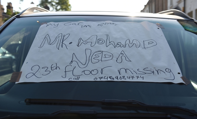A missing person sign on a car near the site of the blaze