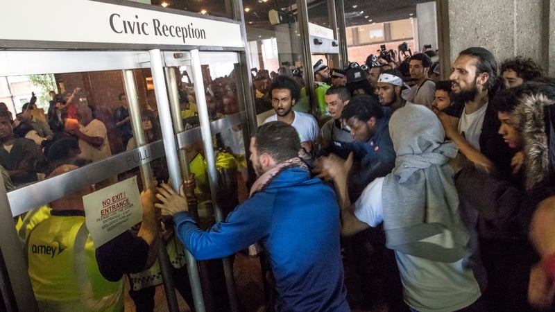 Protesters storm Kensington Town Hall in London