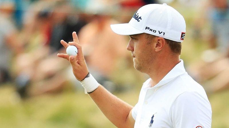 Justin Thomas salutes the crowd