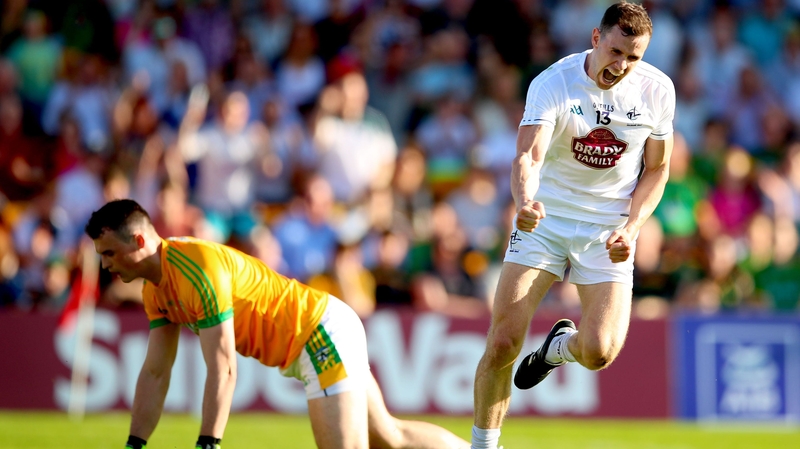 Meath's goalkeeper Paddy O'Rourke dejected as Cathal McNally celebrates scoring his side's opening goal
