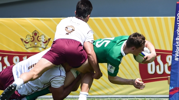 Ireland's Alan Tynan scores a try