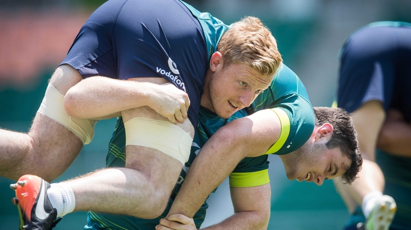 James Tracy gives James Ryan a lift in training
