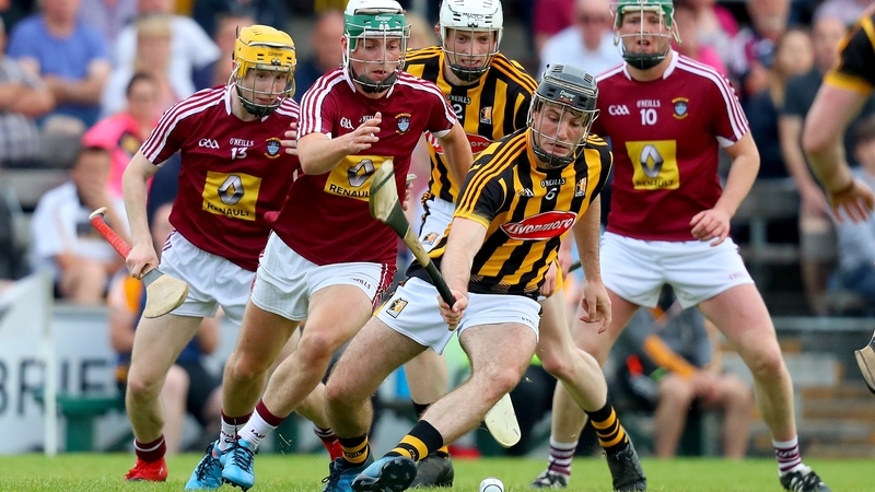 Michael Daly and Jason Cleere battle for possession