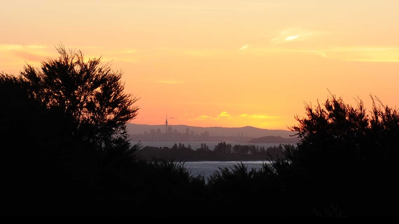 The city of Auckland is seen at sunset from Waiheke Island