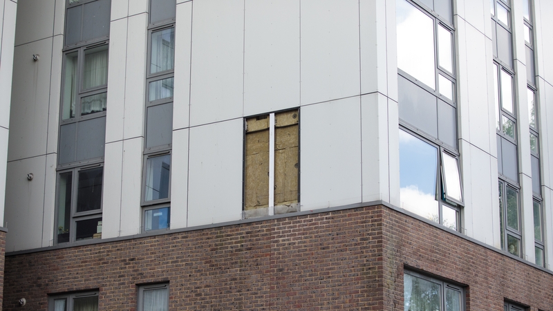 A hole where a panel of cladding was removed is pictured on the Bray residential block in the Chalcots Estate in Swiss Cottage, London