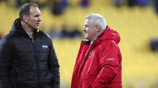 Lions' head coach Warren Gatland speaks with Hurricanes' assistant coach John Plumtree before the game