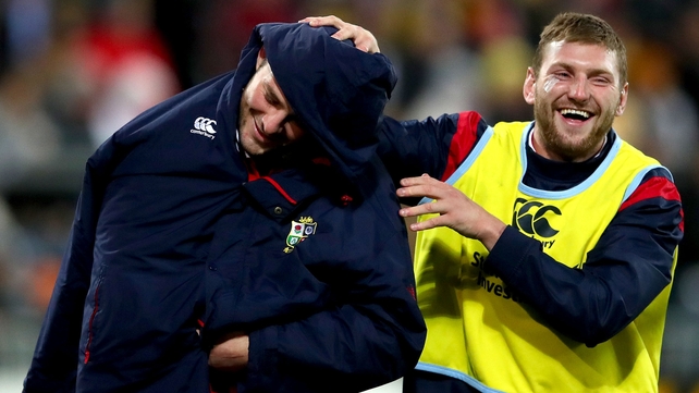 Lions' Finn Russell jokes with Robbie Henshaw at half-time