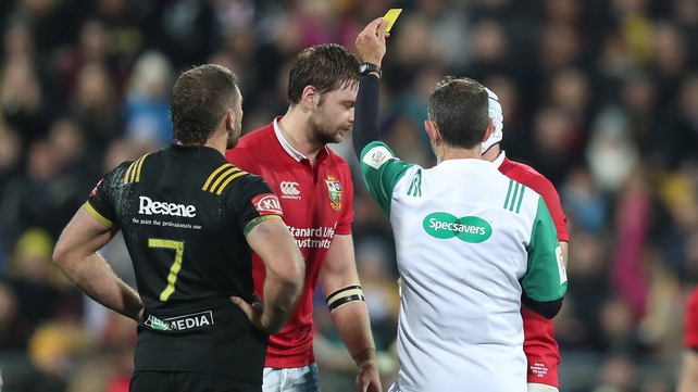 Iain Henderson is yellow carded by Romain Poite